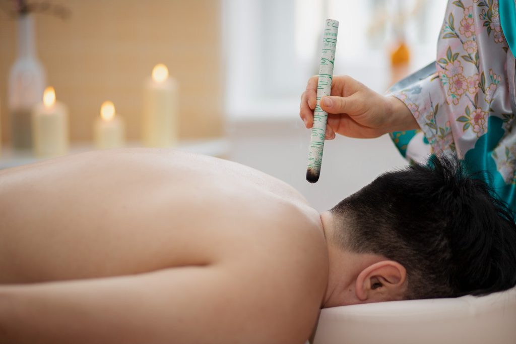 Female to Male Massage Center Multan – Traditional moxibustion therapy for deep relaxation and healing.